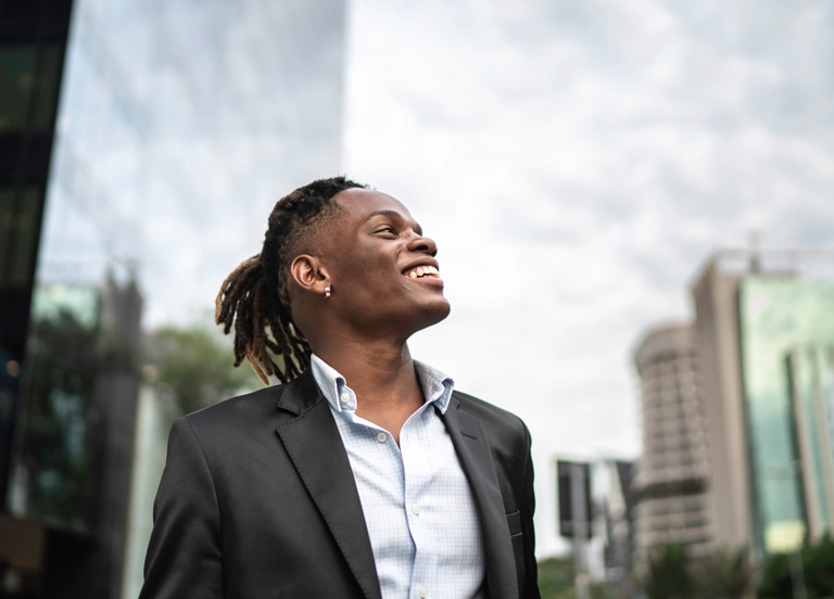 A businessman contemplating the sky